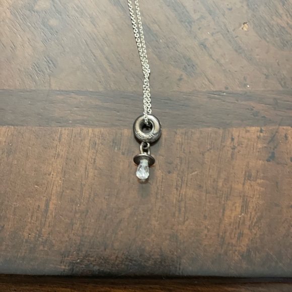 Silver necklace with a circle at end and pacifier at end of circle - Picture 4 of 6